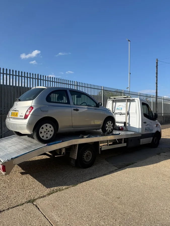 KCS Recovery truck carrying a silver Nissan Micra in Kent