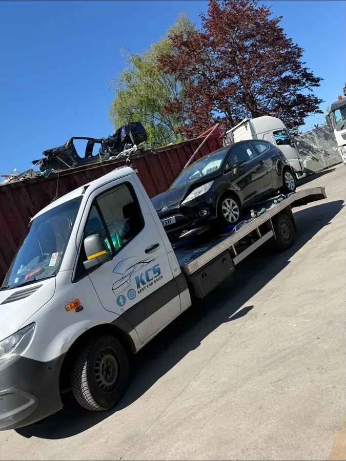 KCS Recovery truck collecting an end of life car at a scrapyard